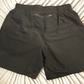 Mens black training shorts with zipper in back and towel holder
